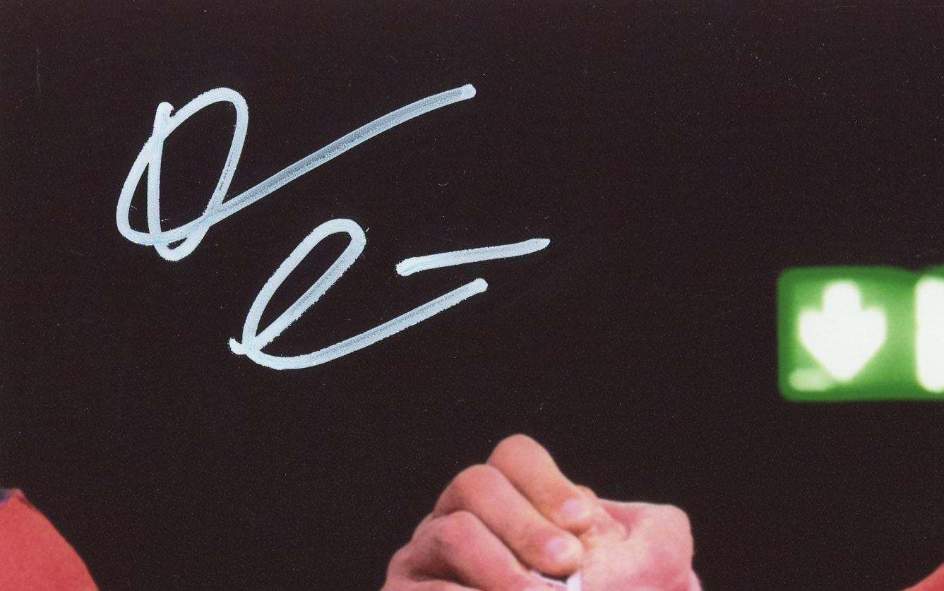 Devon Larratt Signed Unframed 8x10 Arm Wrestling Photo - Black, Red and Yellow Shirt - Image 2