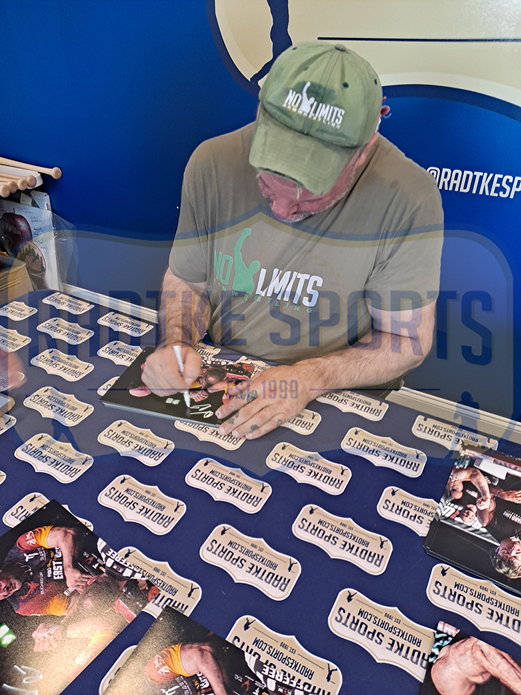 Devon Larratt Signed Unframed 8x10 Arm Wrestling Photo - Black, Red and Yellow Shirt - Image 3